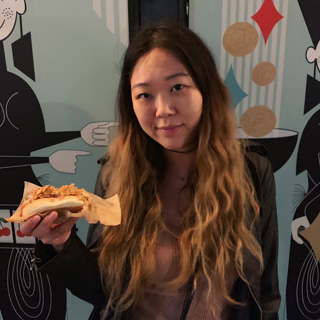 Girl holding hot dog