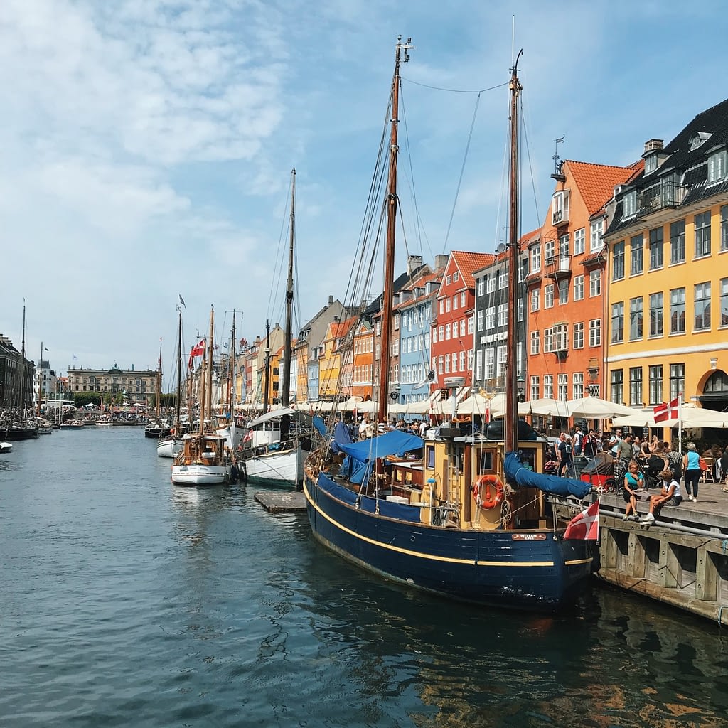 Colorful buildings along canal with boats docked