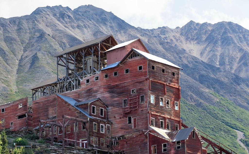 Red building with mountains behind it