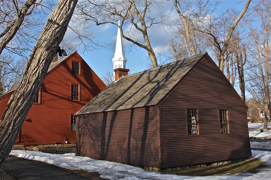 Small brown house and red house next to each other