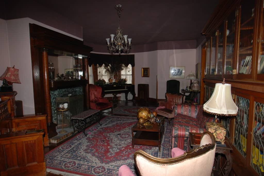 Dark interior of inn, purple and red old-fashioned decor