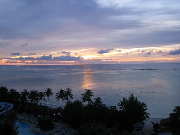 Purple sunset over the water in Saipan, taken from a high vantage point